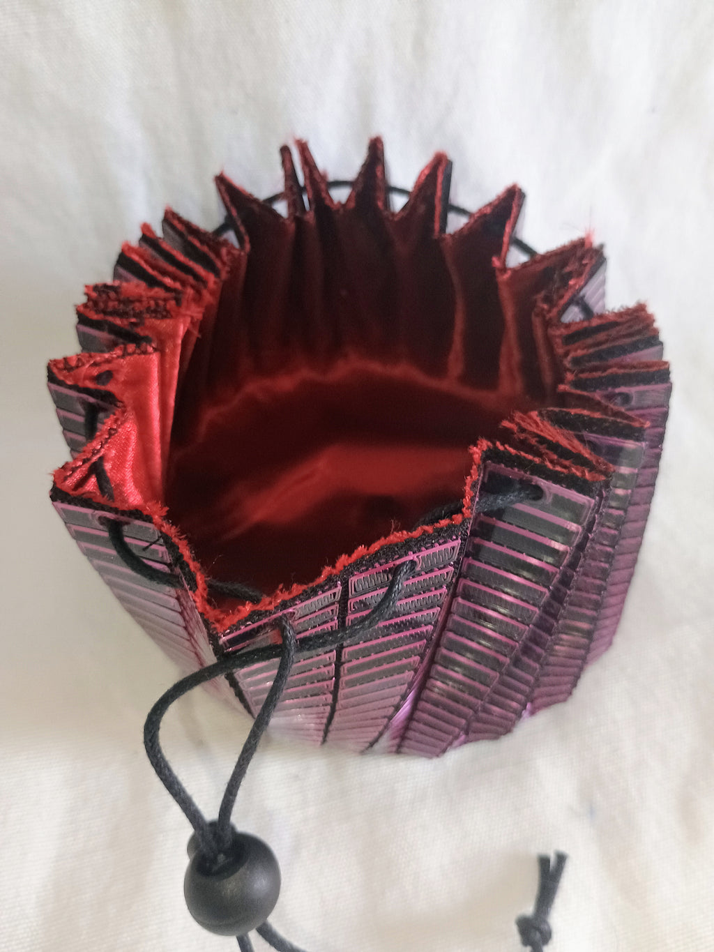 Pink and black 3d printed dice bag with red satin liner